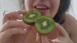 Chewing fetish eating a kiwi