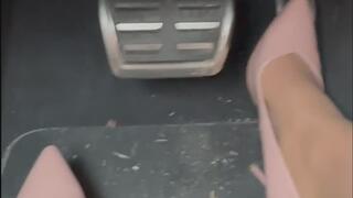 Sexy girl driving the Audi on german autobahn in sexy pink heels and nylons