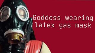 Dominant goddess wearing latex gas mask