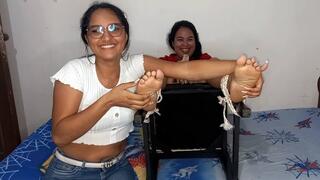 Celeste tickles Gaby's feet