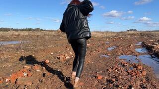 the girl was trying to get out of the sticky, slippery, cold mud, she was wearing slippers, but the slippers were so stuck in the deep mud that she had to leave them there and get out barefoot