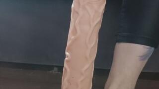 A footjob on a huge cock