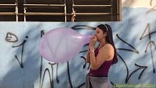 Laura Blows to Pop Four 16-Inch Punchballs
