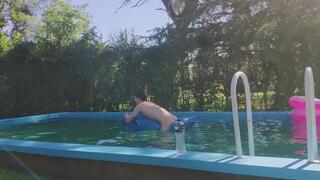 Riding my Inflatable Whale at the Pool