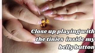 Close up playing with the tinies inside my belly button