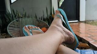 Katherine flip flops and highly arched feet under the rain