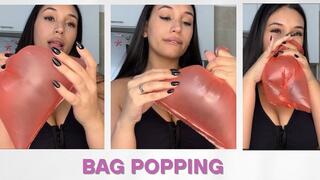 Popping bags with my hands