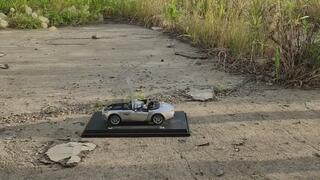 cute girl hard tramples and crushes toy car