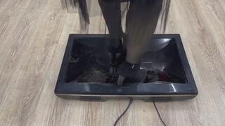 cute beautiful girl crush TV with high heels boots trample