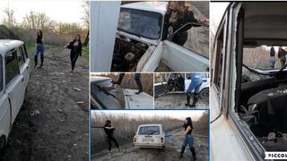The girls smash an old useless car because it stopped moving