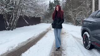 A girl walks on slippery melted snow, snow gets on her toes, she feels cold from this, she slips and tries to walk in these shoes