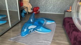 girl riding and s2p blue inflatable whale