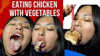Eating chicken with vegetables
