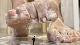 A Tiny under the feet of a Giantess, covered in a white substance