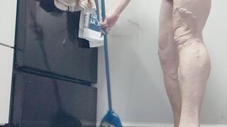 Tempest cleaning naked in the kitchen