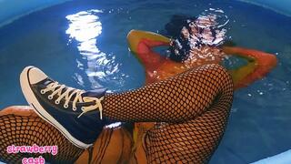 Underwater in fishnets and Converse