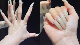 Showing off my elegant long natural nails in the mirror