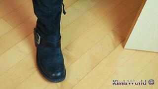 Rugged Elegance – Worn Tights & Biker Boots in a Black Minidress