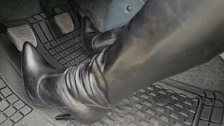 Katherine struggling to drive the Toyota Prado on her Black Berlin 110 boots