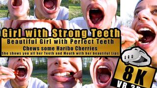 VR 3D 8K - Beautiful Girl shows her perfect teeth and bites, chews, squashes with her Strong Teeth very close to the camera Haribo Happy Cherries