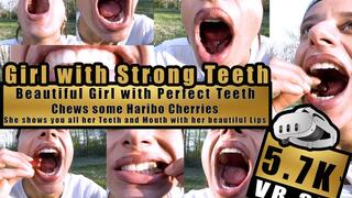VR 3D 6K - Beautiful Girl shows her perfect teeth and bites, chews, squashes with her Strong Teeth very close to the camera Haribo Happy Cherries