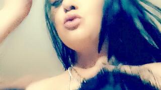 Black corset smoking a Capri