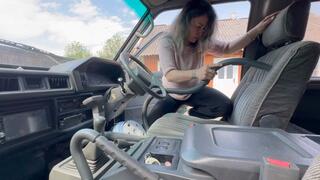 she cleans her van with blue vacuum cleaner