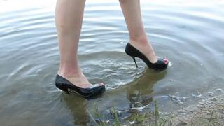 platform spike high heels in lake, wet shoes, high heels stuck in sand, wet high heels