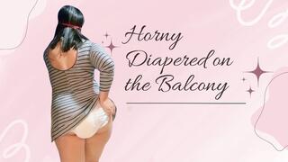Playing DIAPERED on the balcony