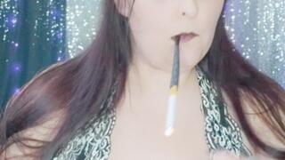 Nicki Pie smokes with cigarette holder plays with her tits