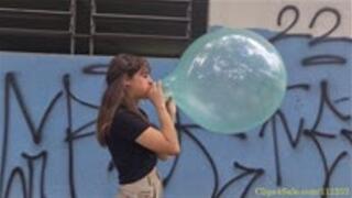 Katie Blows to Pop a Soapy 16" Gemar Balloon