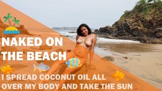 Nudist and exhibitionist girl puts on suntan oil and sunbathes naked on the beach