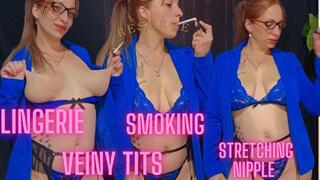Girl smoking, showing off her new lace lingerie and veiny tits