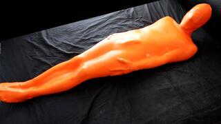 Trapped in a skintight orange latex sack