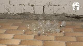 Glass balls and light bulbs under wooden Sandals