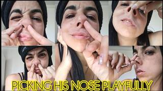 Picking his nose playfully!