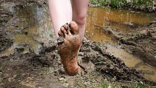 Dirty barefoot outdoor, wet and muddy feet, feet in mud, messy feet, dirty feet