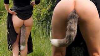 A beautiful Woman strolls in the Forest while carrying a Fox Tail Butt Plug in her Ass