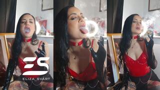 Smoking in a red pvc bodysuit and leather gloves