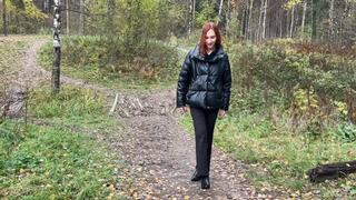 A girl in high-heeled ankle boots is trying to climb a slippery muddy slide, but she can't do anything (reissue)