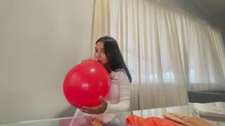 Akina blows balloons at her dining table part 2