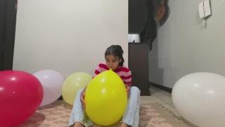 Akina blows Balloons on the floor