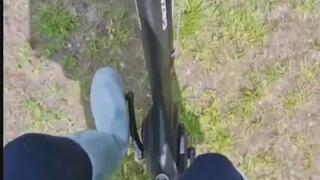 German woman with Hunter and cowboyboots in wood, Foot bends around