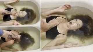 The guy teaches Milana to hold her breath underwater