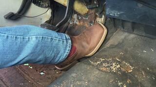 Cowboy boot pumping the gas pedal, cranking it, and revving it up