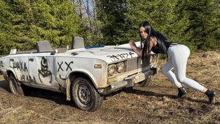 CAR STUCK The wheels are slipping in the wet grass