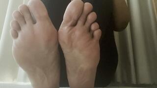 showing soles and bending toes