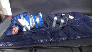 Myxxxy bound and gagged in shiny nylon blue Rainwear trying to free herself