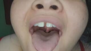 Big girl shows her uvula by opening it