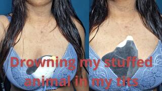 Squashing the stuffed with my tits